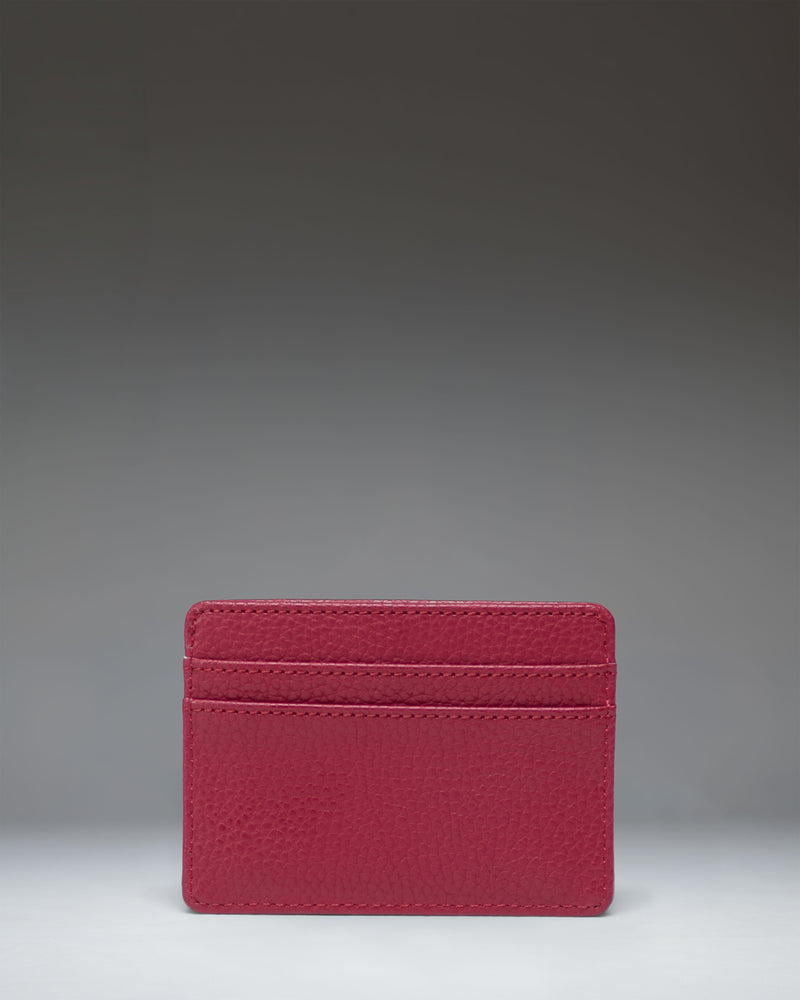 Herschel Supply Co. Charlie Cardholder Vegan Leather in Cherry Red. Front view showing multiple card slots and the signature woven label.