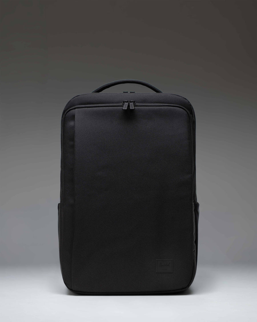 Herschel Supply Co. Kaslo Backpack Tech in black, showing the front view with zippered compartments and shoulder straps.