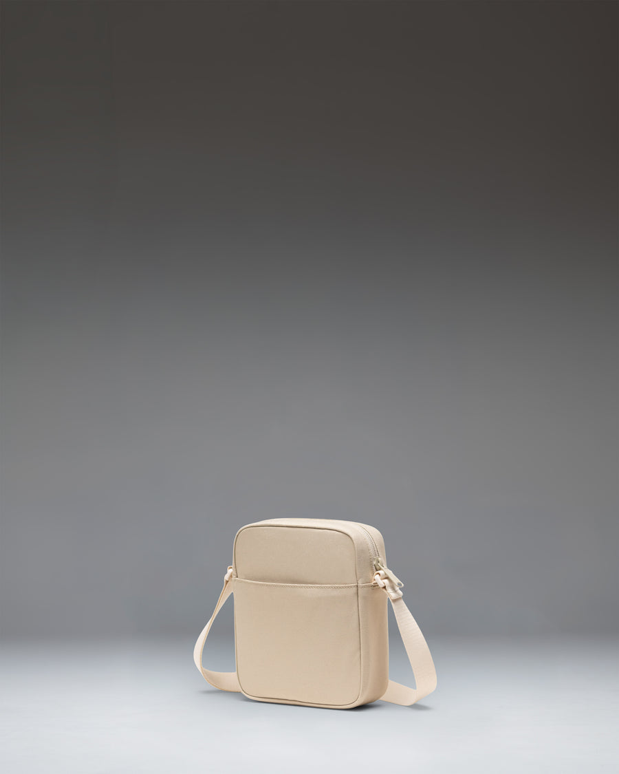 Herschel Heritage Crossbody bag in Eucalyptus green, showing the adjustable shoulder strap and signature diamond detail.