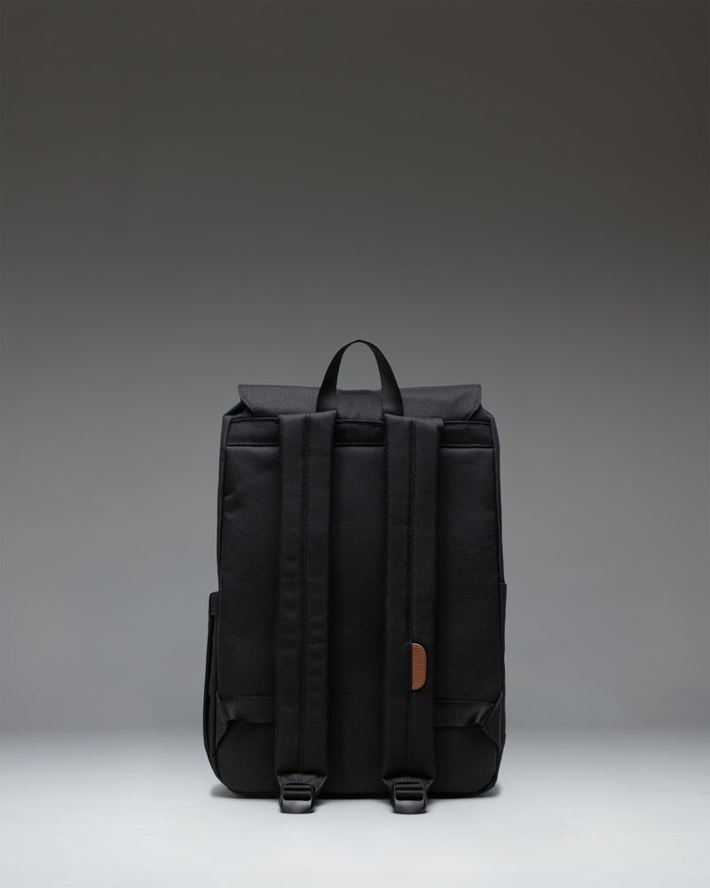Herschel Retreat Small Backpack in Black, featuring a clean everyday design with dual magnetic strap closures.