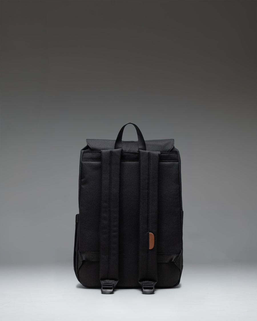Herschel Retreat Small Backpack in Black, featuring a clean everyday design with dual magnetic strap closures.