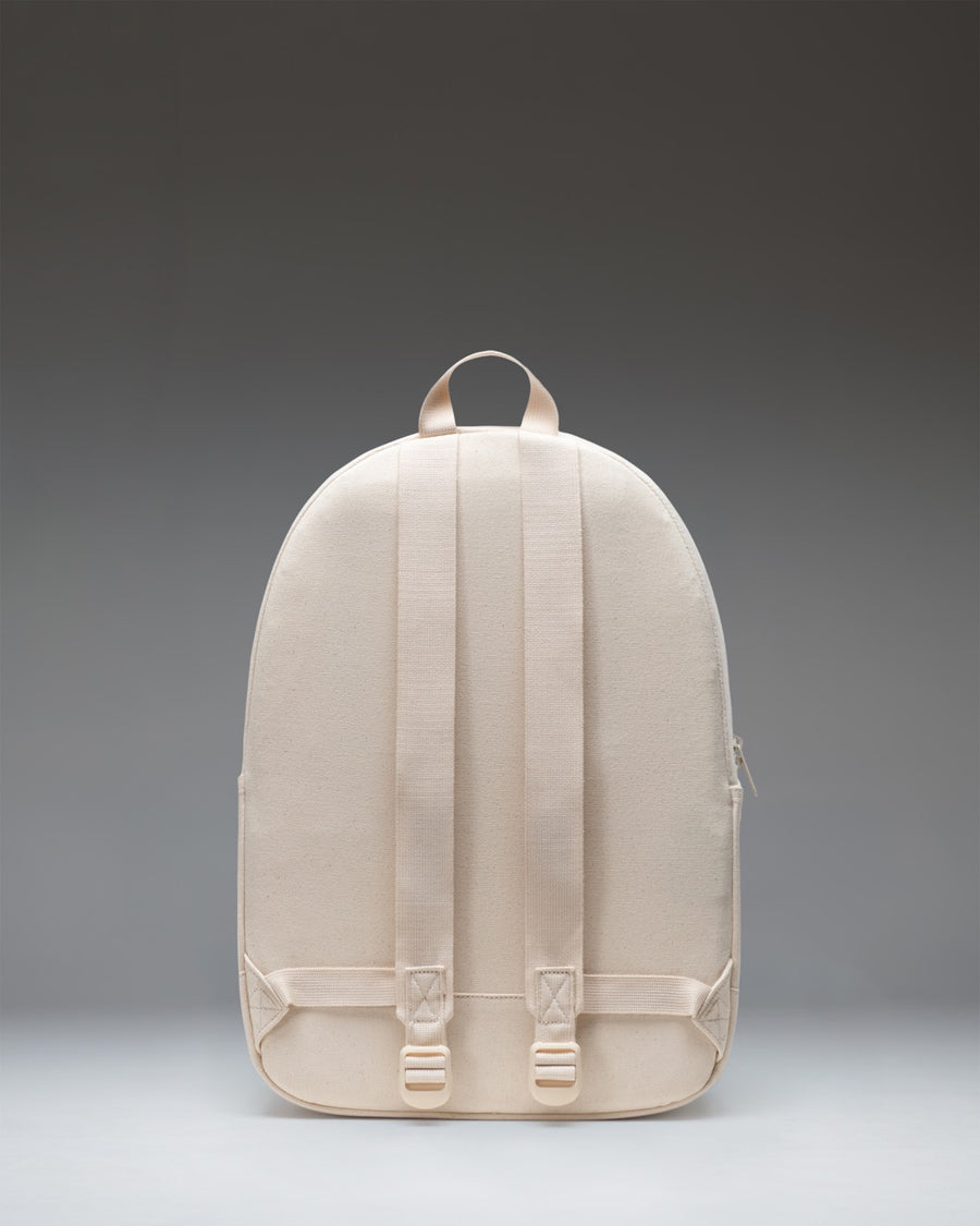 Herschel Supply Co. Pacific Daypack in Natural color shown from the front, highlighting its minimalist design, zippered main compartment, and straps.
