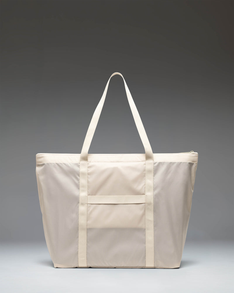 Herschel Supply Co. Portland Packable Tote in Moonbeam Tonal, showing the lightweight travel bag unfolded and ready for use.