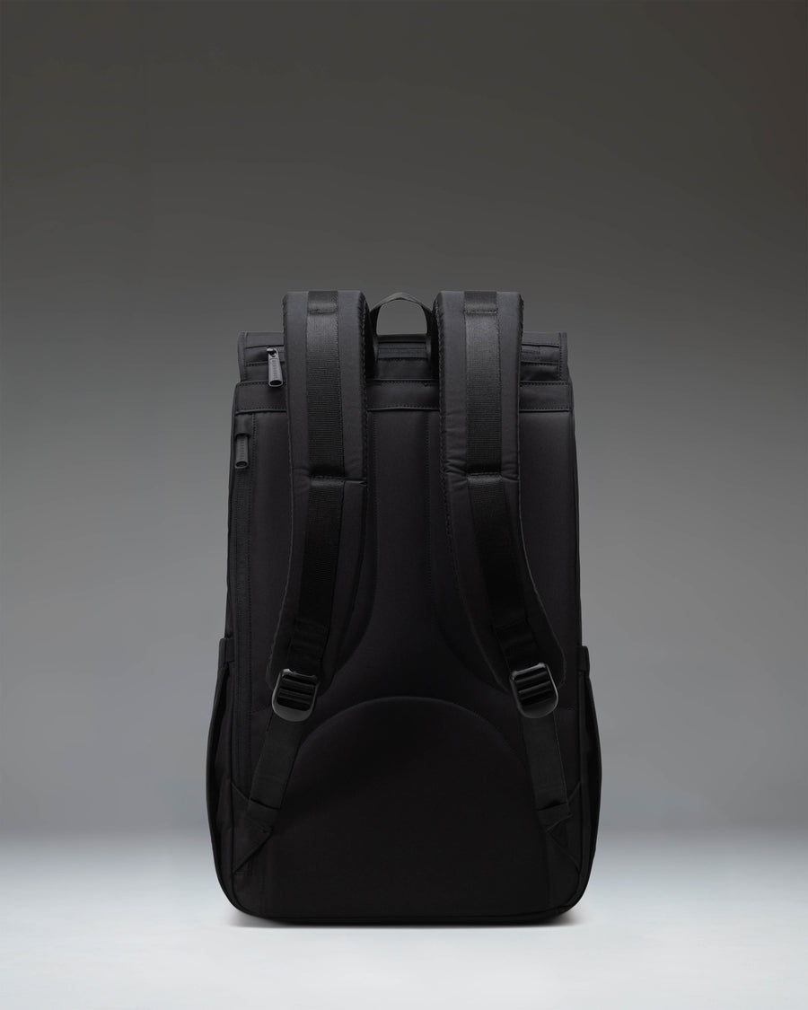 Herschel Little America Backpack in black, showcasing its classic mountaineering style with dual rubber straps and front pocket.