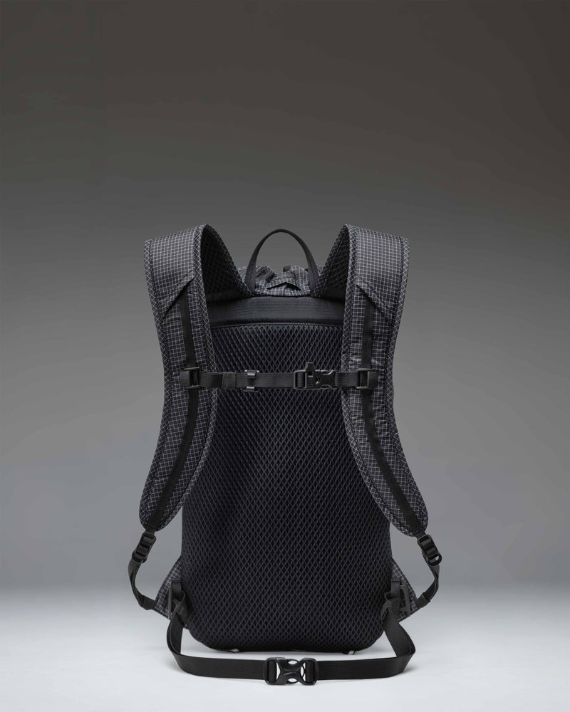 Herschel Supply Co. Ultralight Cinch Daypack 14L in Black shown from the side on a white background, highlighting its lightweight, durable fabric.
