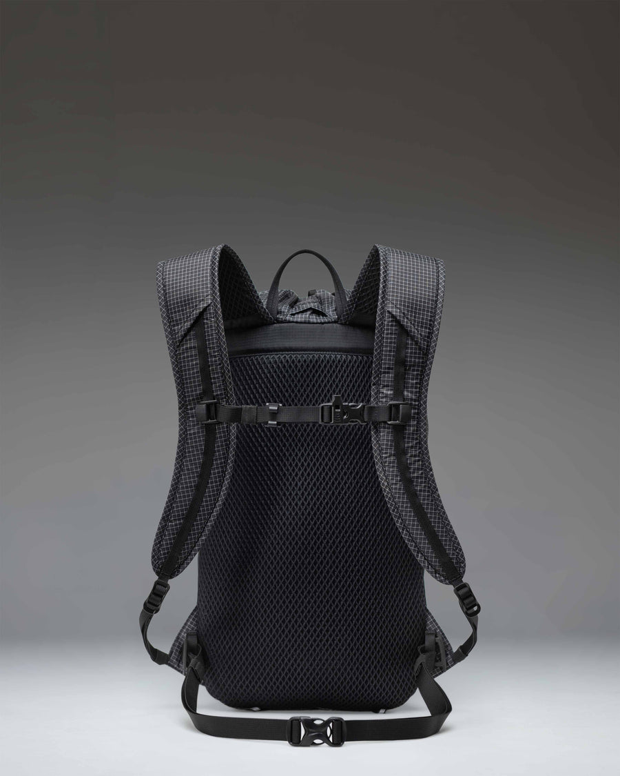 Herschel Supply Co. Ultralight Cinch Daypack 14L in Black shown from the side on a white background, highlighting its lightweight, durable fabric.