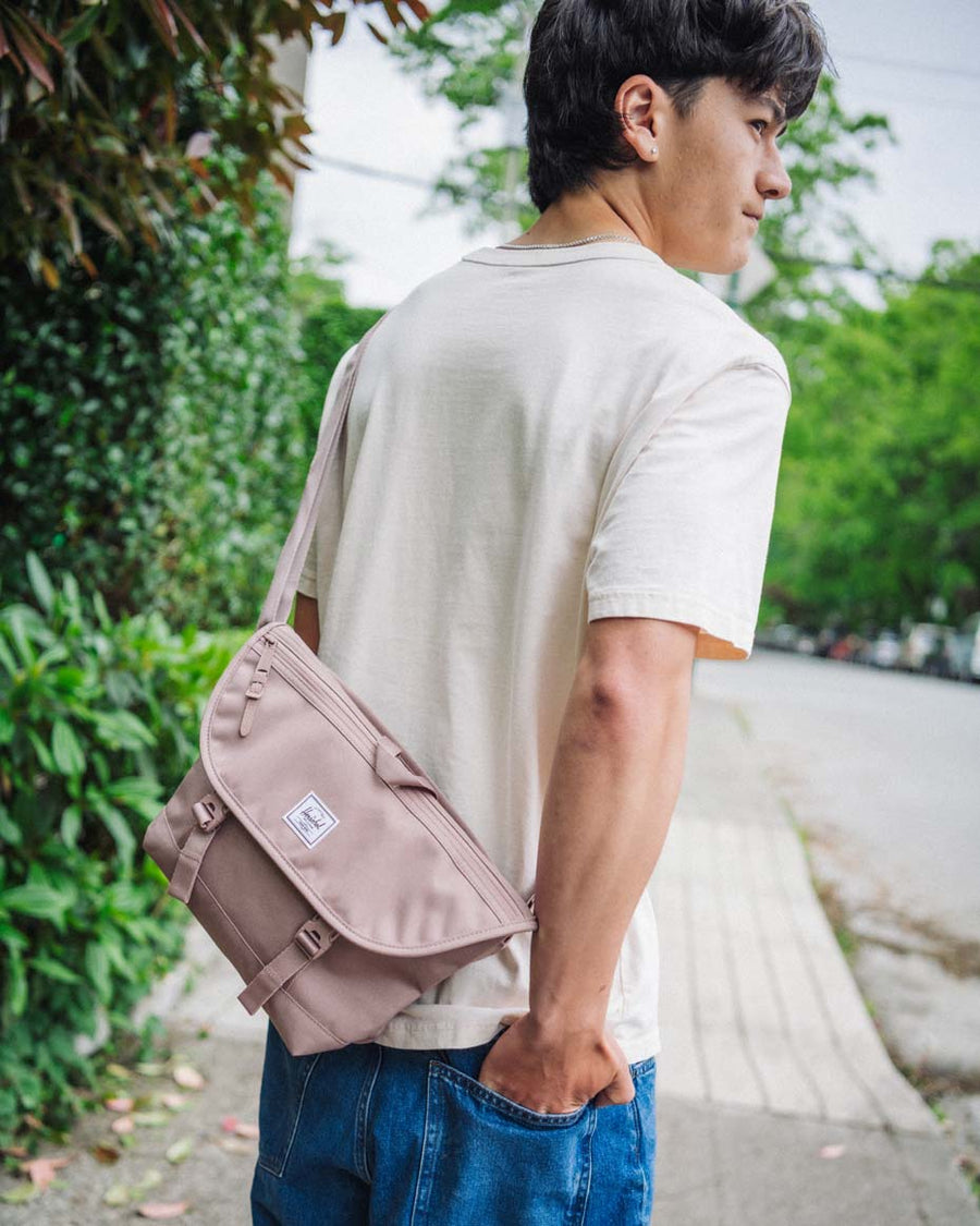 A grid display showing the Herschel Supply Co Cove Small Messenger bag available in a wide variety of different colors.