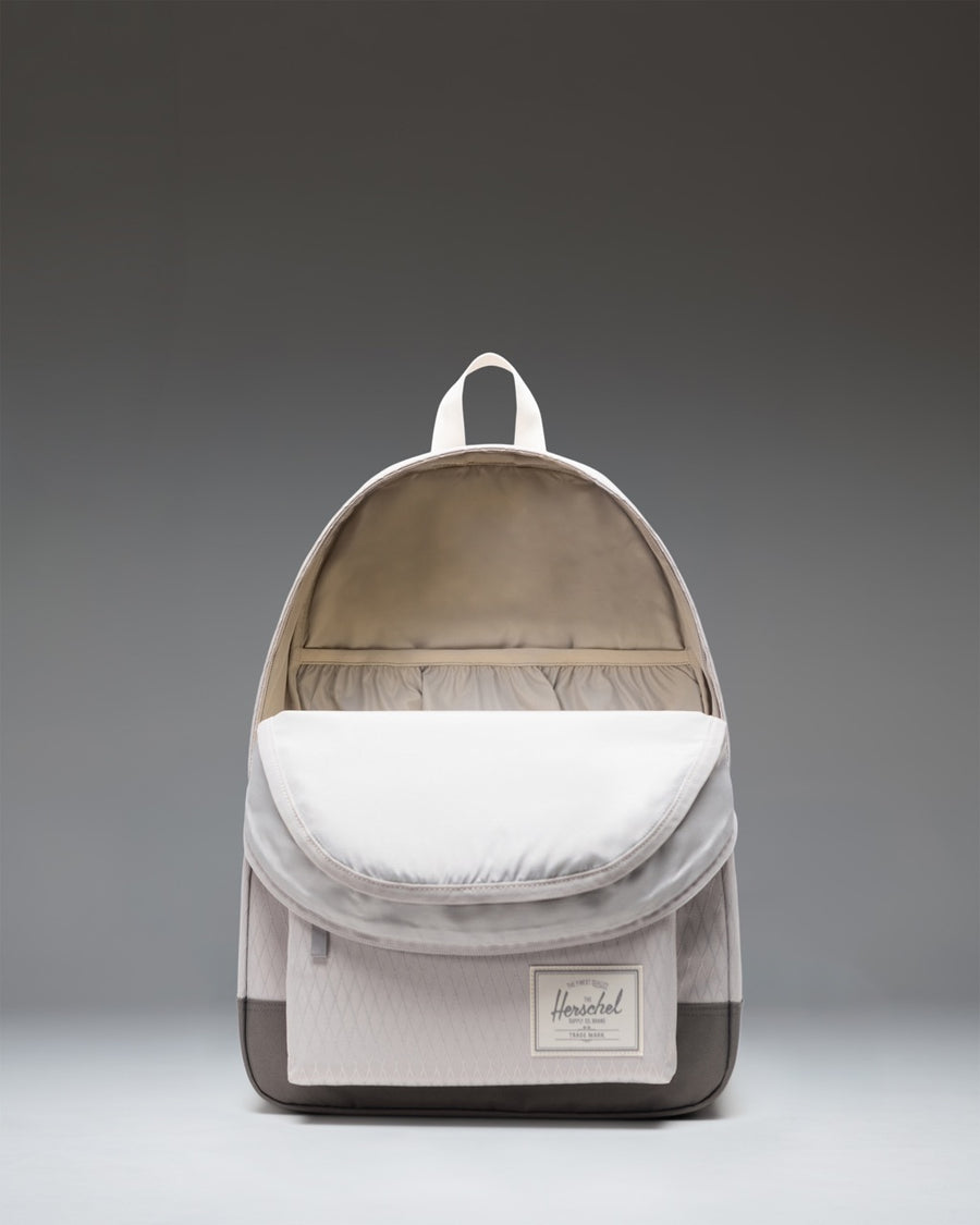 Herschel Classic XL Backpack in Vapor Diamond/Charcoal Gray showcasing its spacious design, dual water bottle pockets, and front storage pocket.