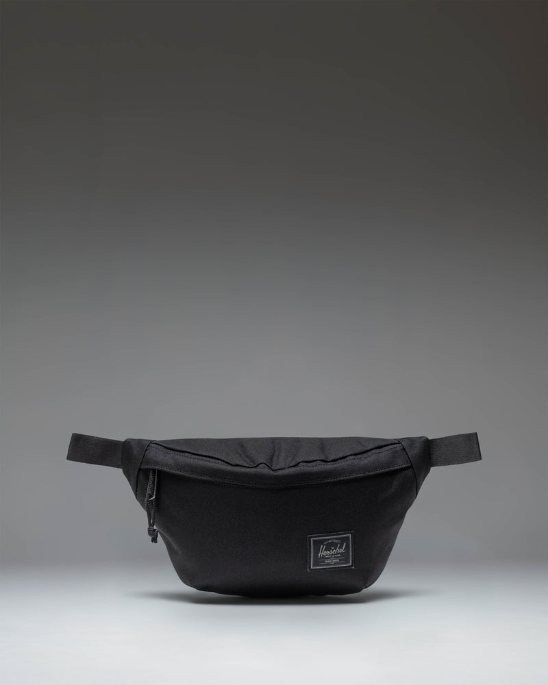 Herschel Classic Hip Pack in Black Tonal fabric, showing the front view with zipper closure and brand logo.