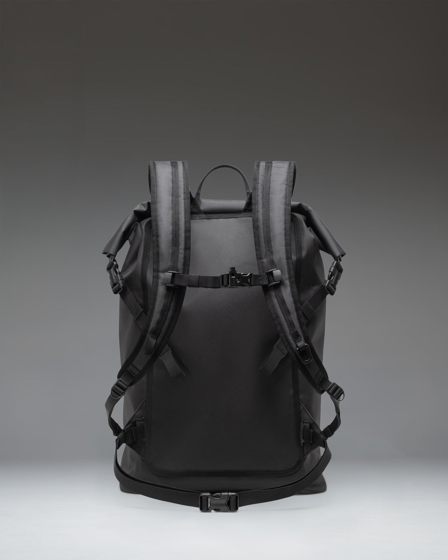 Herschel Supply Co. Dry Bag Backpack 32L in black, showcasing a detailed view of its waterproof design.