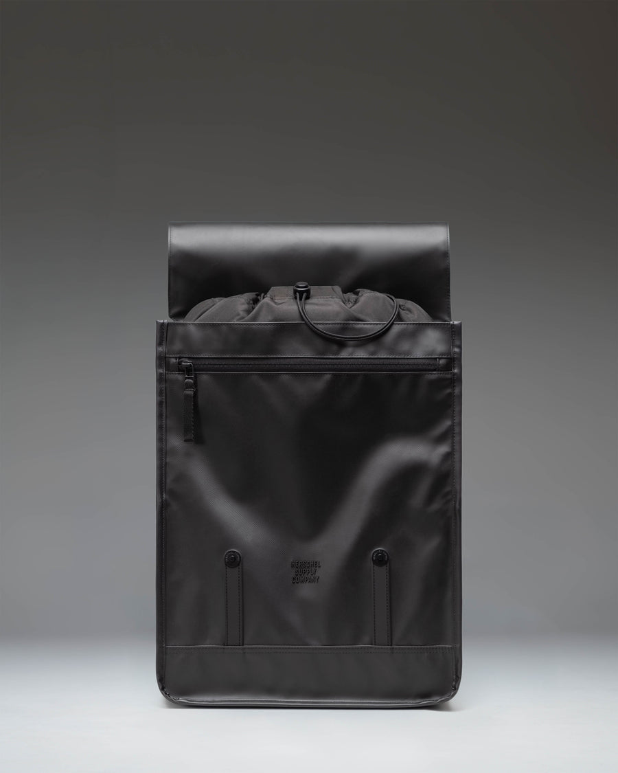 Herschel Survey Backpack in Black, showing a detailed lifestyle or studio view highlighting its clean design and functional layout.