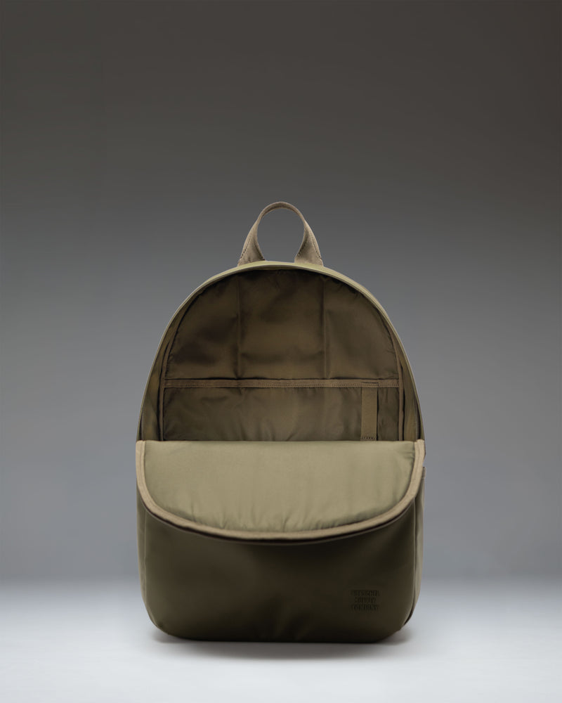 Herschel Supply Co. Alberni Backpack in Ivy Green, showcasing its durable design, spacious main compartment, and comfortable shoulder straps.