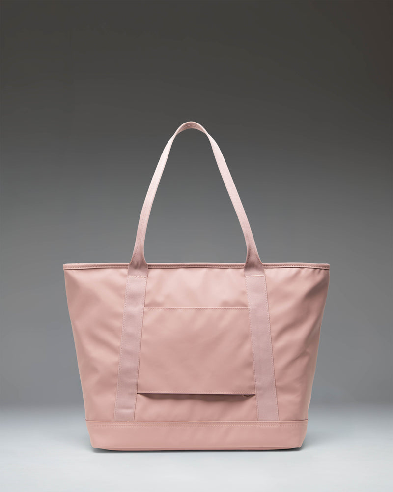Herschel Supply Co. Alberni Tote bag in Ash Rose pink, showing the spacious interior and dual top carrying handles.