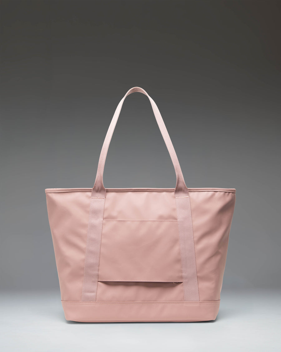 Herschel Supply Co. Alberni Tote bag in Ash Rose pink, showing the spacious interior and dual top carrying handles.