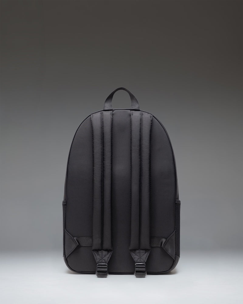 Herschel Supply Co. Kaine Backpack in black, featuring a multi-pocket design, top handle, and classic woven label.