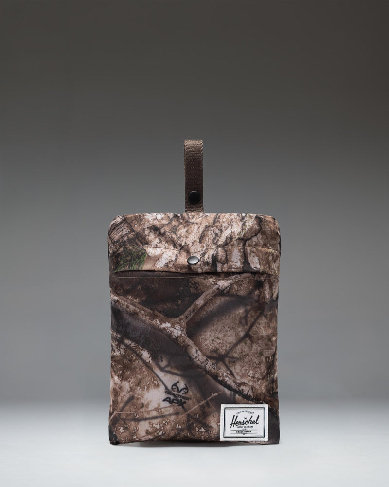 Herschel Supply Co. Realtree Rome Packable Backpack in Realtree APX Camo pattern, showing the lightweight and foldable design.