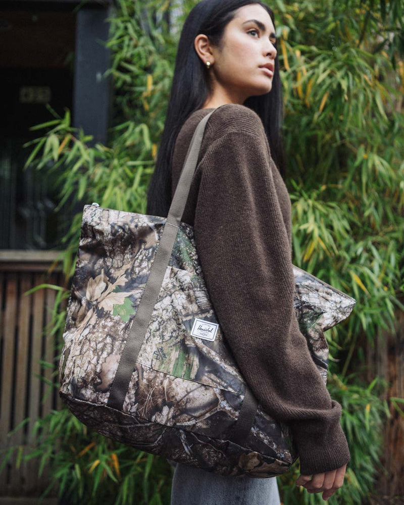 Herschel Supply Co. Realtree Portland Packable Tote in Realtree APX Camo print.