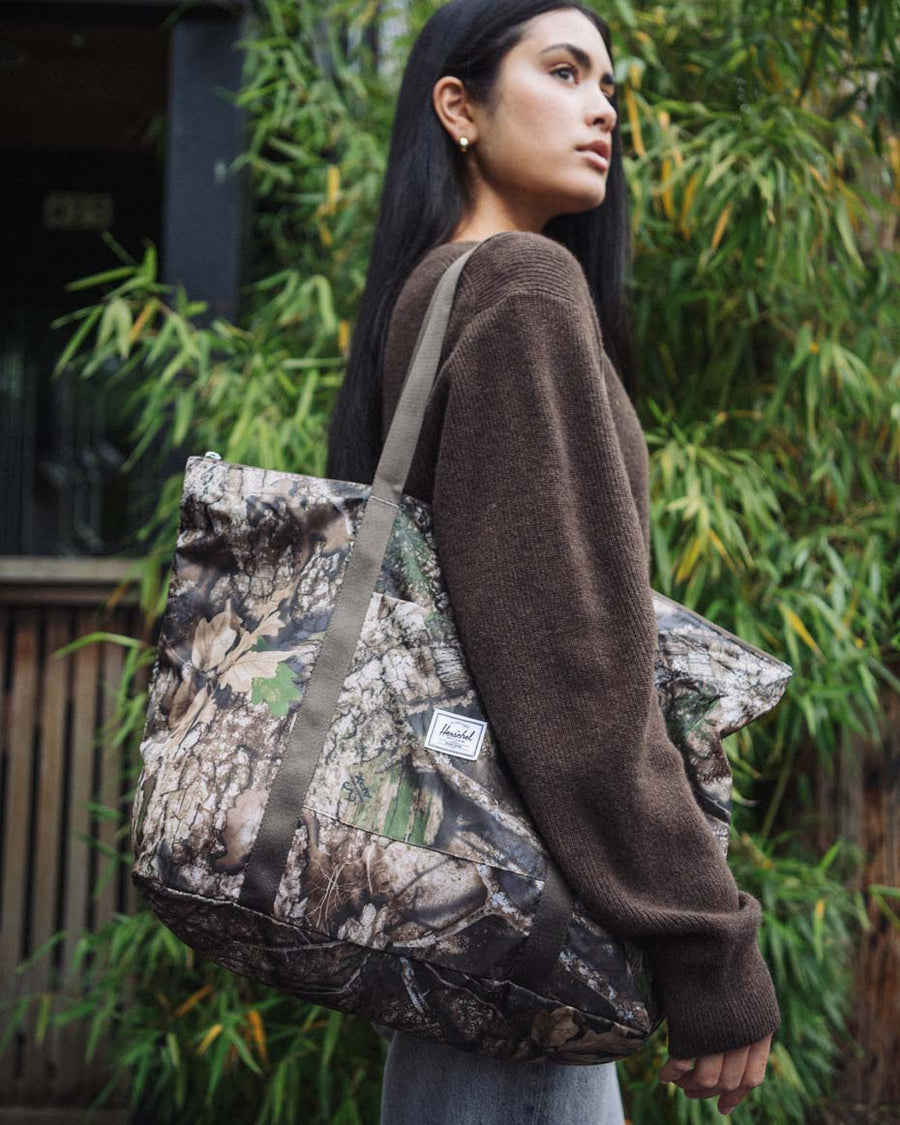 Herschel Supply Co. Realtree Portland Packable Tote in Realtree APX Camo print.