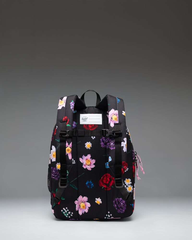 Herschel Supply Co. LEGO Herschel Heritage Kids Backpack in Falling Florals print featuring LEGO brick patterns and vibrant flowers.