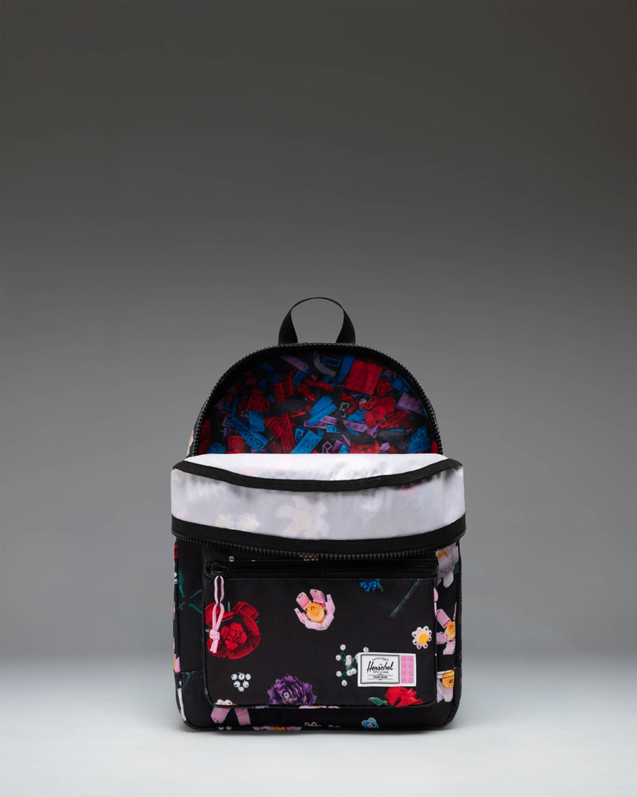 LEGO Herschel Heritage Kids Backpack in Falling Florals, a vibrant floral print pattern with signature LEGO brick details.