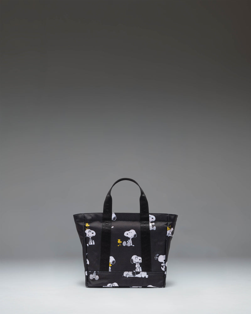 Herschel Supply Co. x Peanuts Heritage Small Tote bag in Snoopy and Woodstock Black featuring an all-over character print.