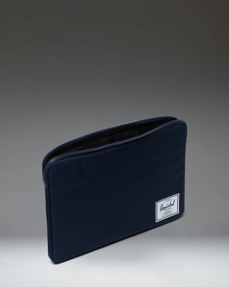 Herschel Supply Co. Anchor 15-16 Inch Sleeve in navy blue, shown from a front angle on a clean background.