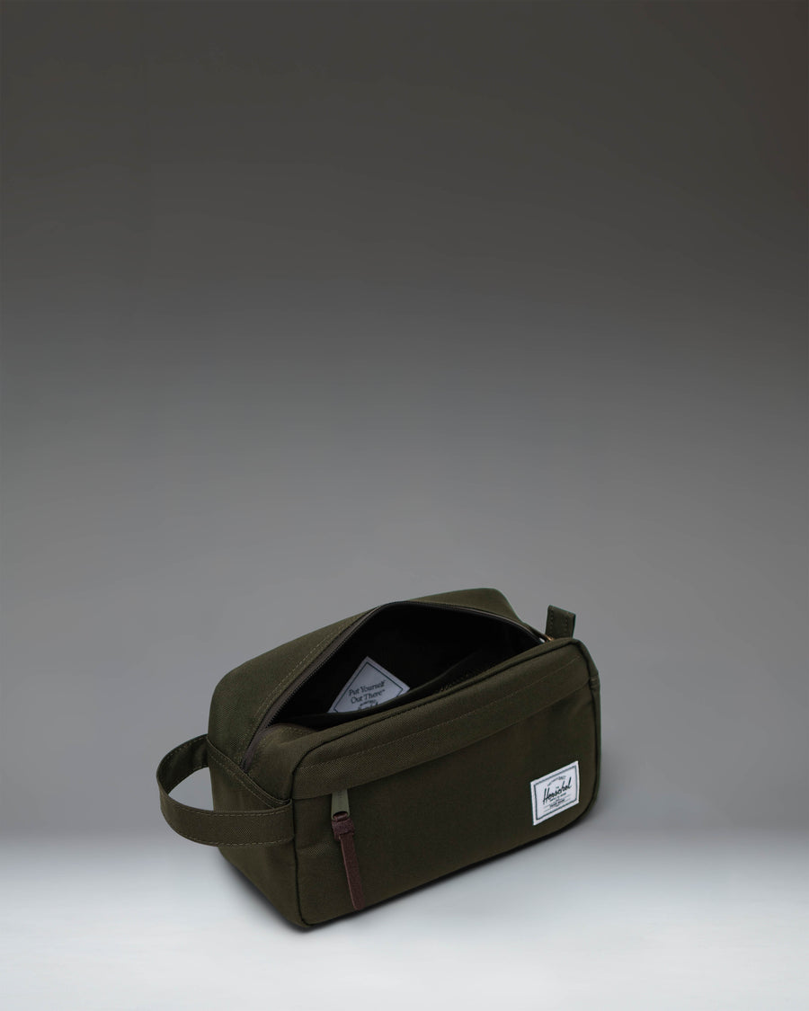 Herschel Supply Co. Chapter Travel Kit in Ivy Green, featuring an organized interior mesh storage sleeve and a front zippered pocket.