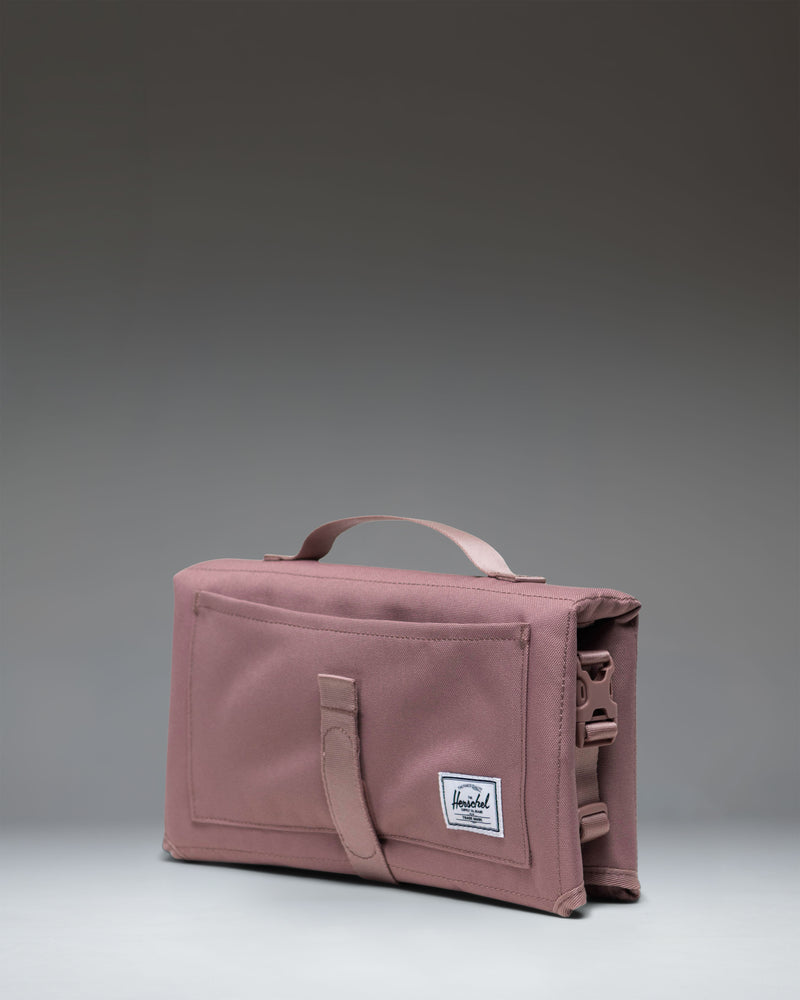 Herschel Supply Co. Sprout Change Mat in Ash Rose.