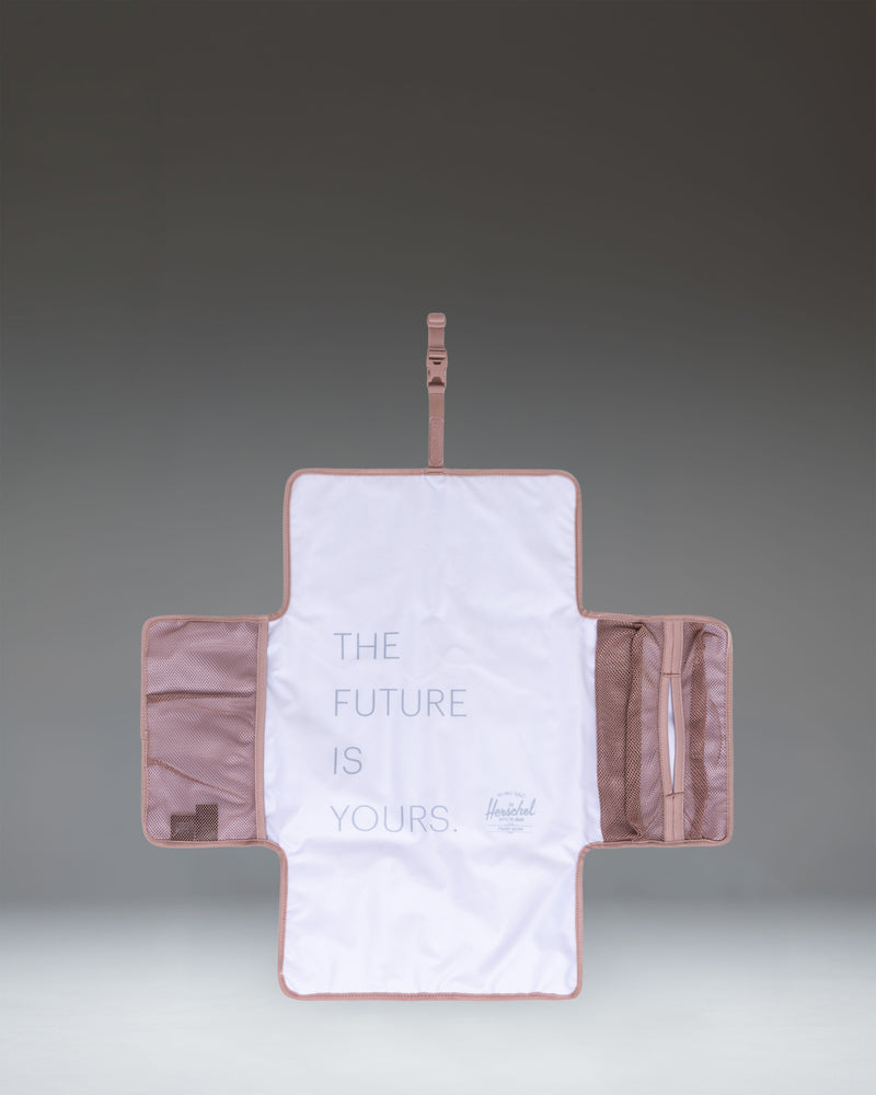 Herschel Supply Co. Sprout Change Mat in Ash Rose pink.