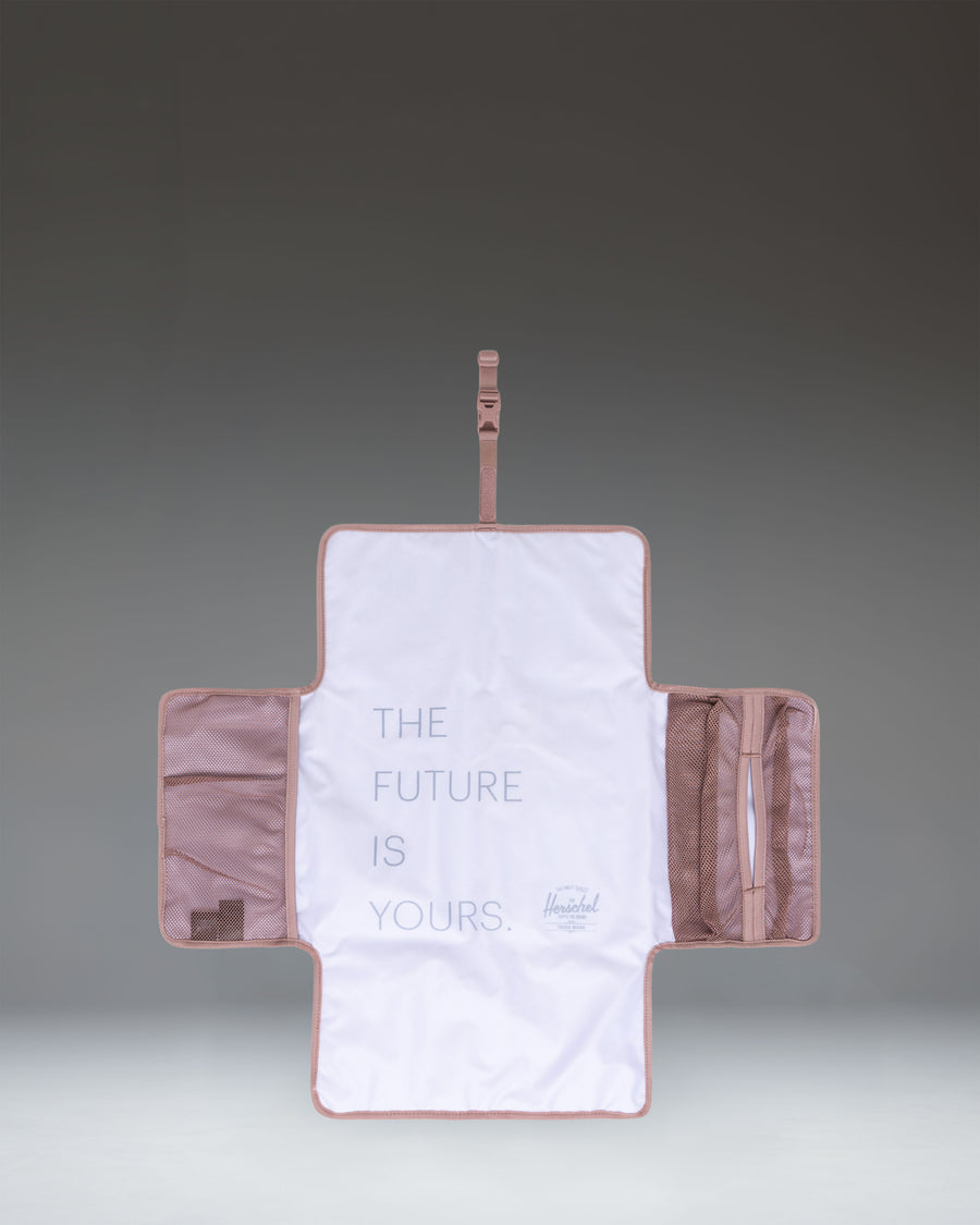 Herschel Supply Co. Sprout Change Mat in Ash Rose pink.