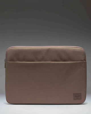 Herschel Supply Co. Denman 15-16 Inch Sleeve Tech laptop case in light brown.