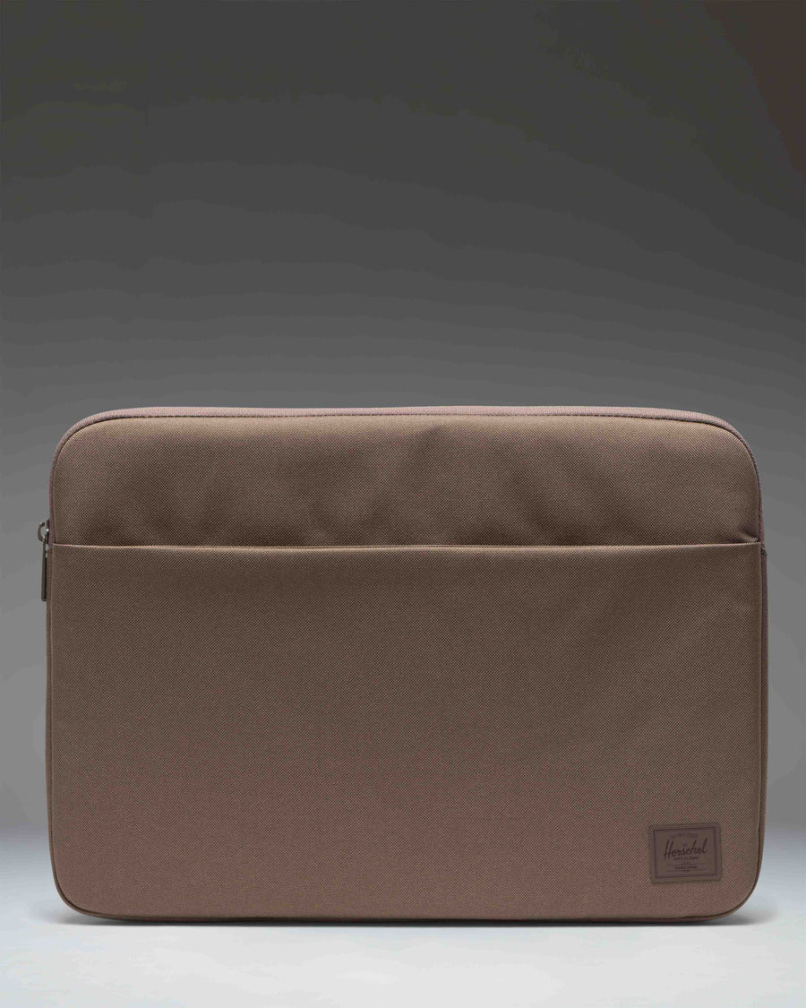 Herschel Supply Co. Denman 15-16 Inch Sleeve Tech laptop case in light brown.