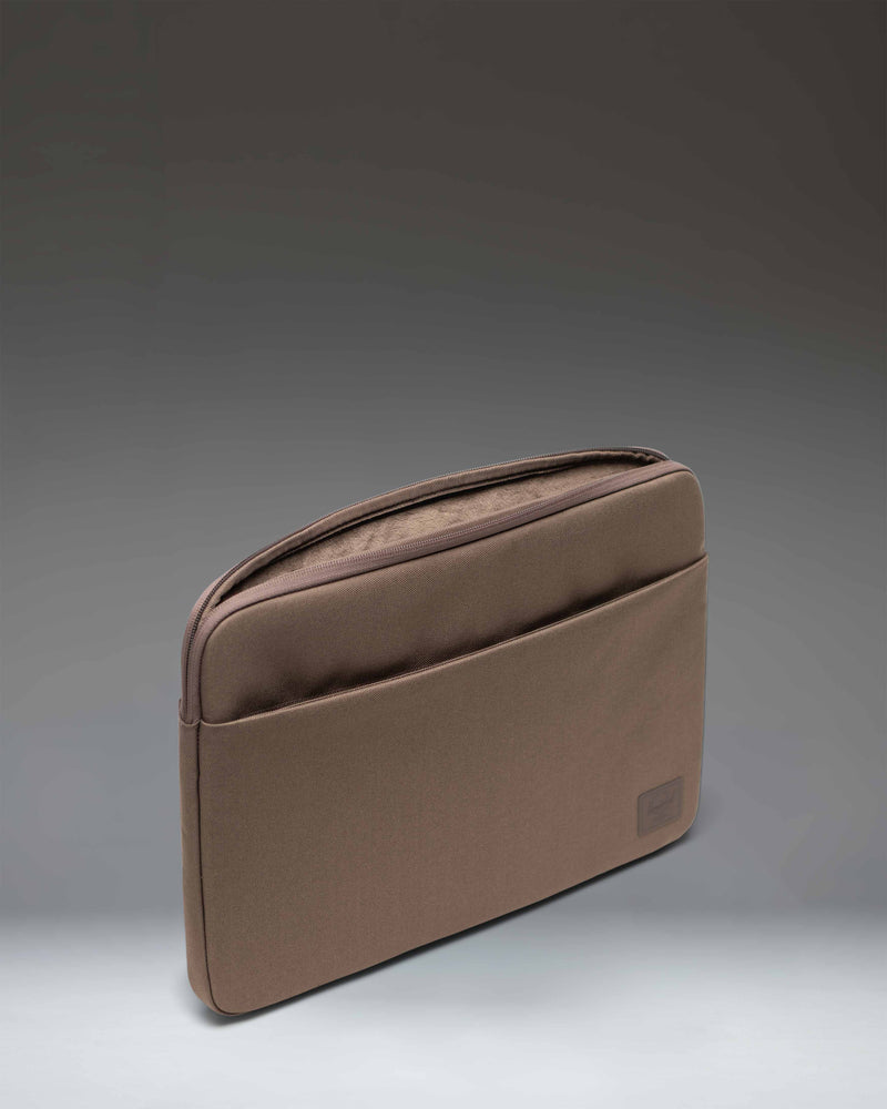 Herschel Supply Co. Denman 15-16 Inch Sleeve Tech in Light Brown, showcasing the front exterior view.