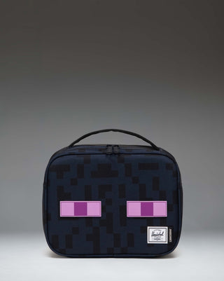 Herschel Supply Co. Minecraft Pop Quiz Lunch Box in black Enderman design, featuring a pixelated eye print and insulated main compartment.