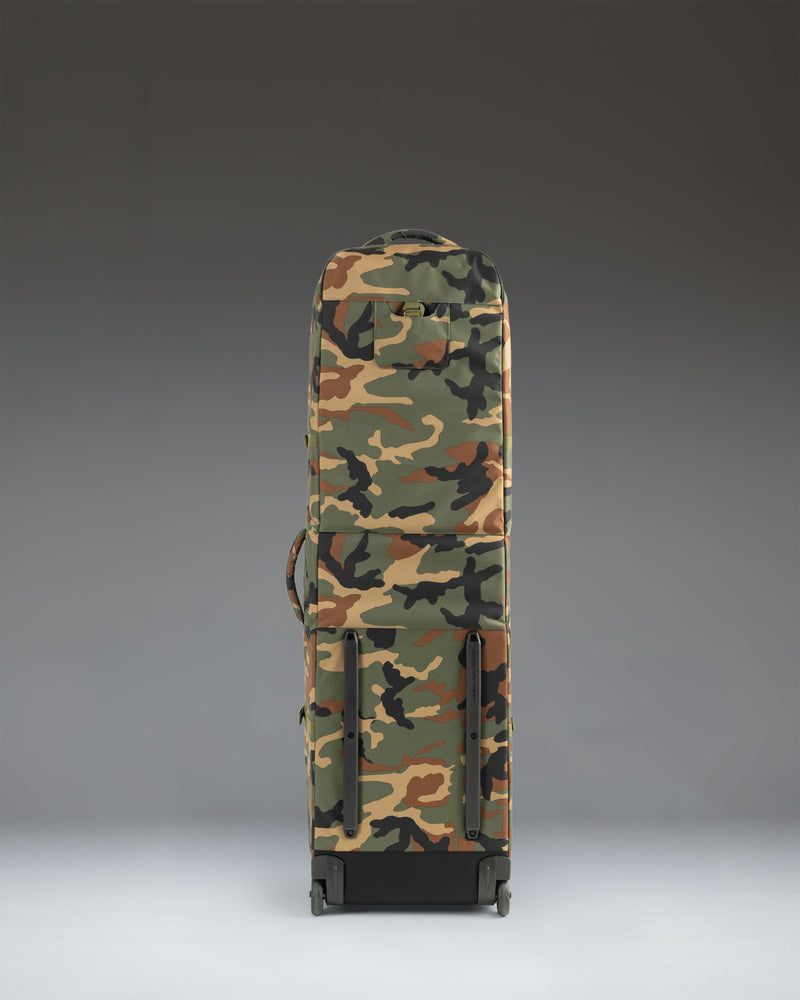 Herschel Heritage Golf Travel Wheelie Bag in Woodland Camo lifestyle view.