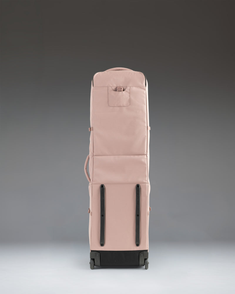 Herschel Supply Co. Heritage Golf Travel Wheelie Bag in Ash Rose pink, showcasing its durable exterior, wheels, and spacious design.