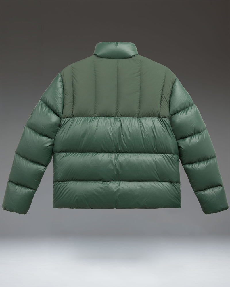 A lightweight, green Pineneedle puffer jacket from Herschel Supply Co. with a water-repellent nylon shell and down insulation.