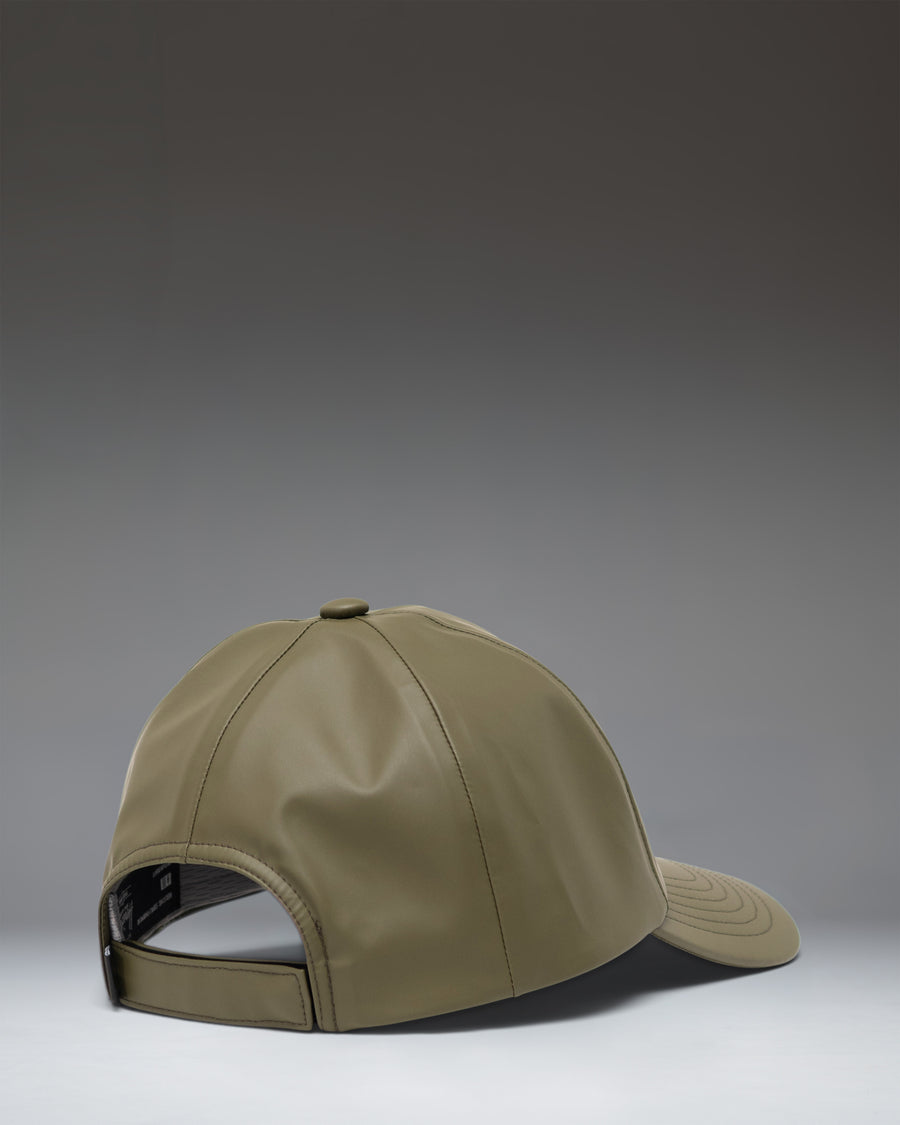 Herschel Supply Co. Sylas Rain Cap in Ivy Green, showing a side view profile.