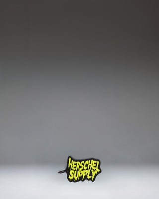 Black Herschel Supply Co. Slime Bag Charm from the Little Herschel collection.