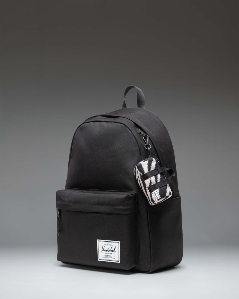 Herschel Novel Duffle Bag Charm in Zebra stripes pattern.
