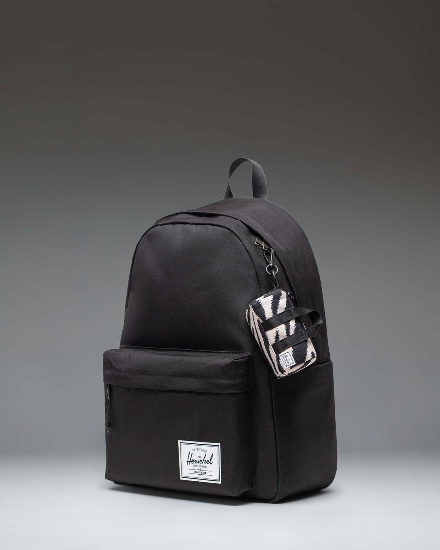 Herschel Novel Duffle Bag Charm in Zebra stripes pattern.