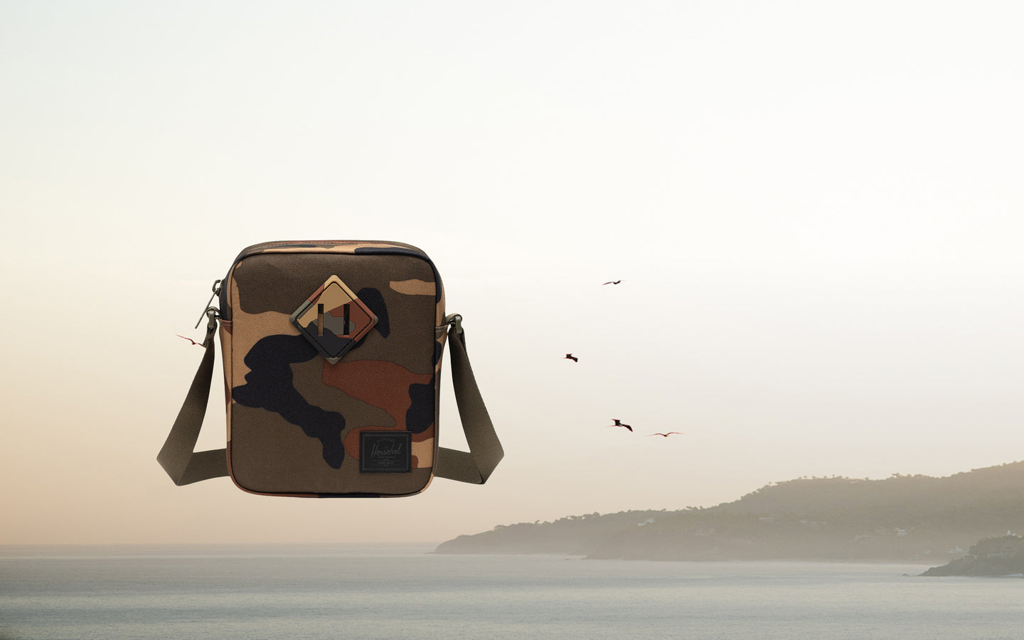 Herschel Supply Co. Heritage Crossbody bag in Woodland Camo/Black Label.
