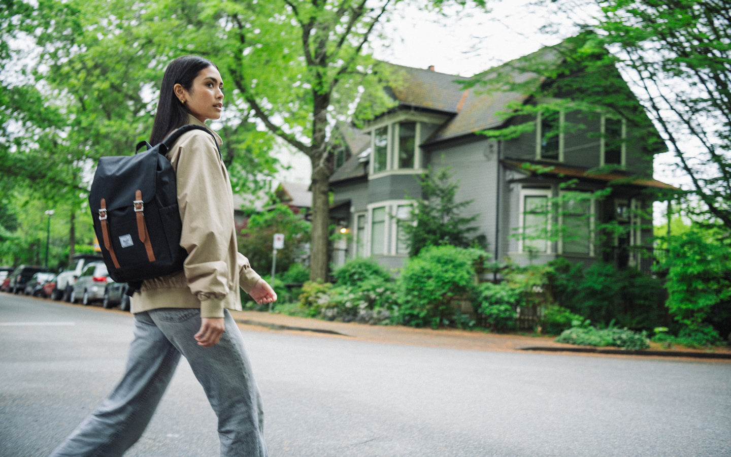 Herschel Retreat Small Backpack in black, featuring a clean, classic design with dual magnetic strap closures.