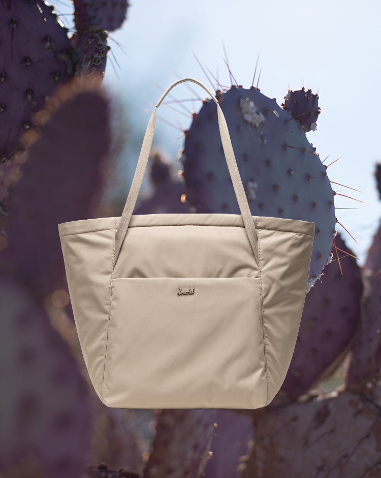 Herschel Supply Co. Joana Tote in Vintage Khaki, a classic canvas tote bag featuring dual carrying handles and a spacious main compartment.