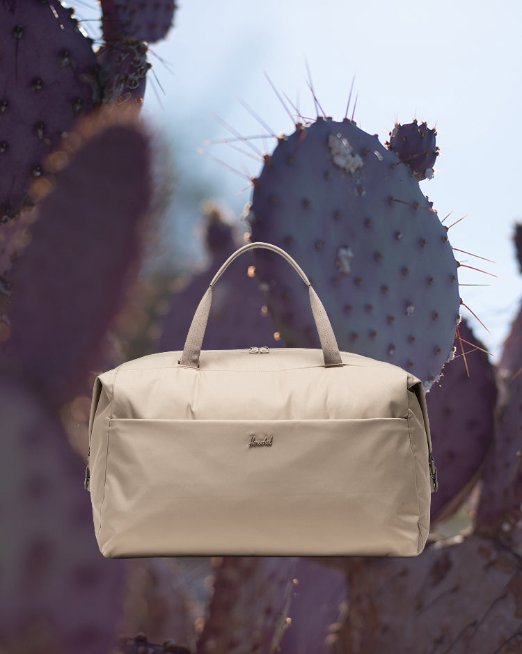 Herschel Supply Co. Vintage Khaki Maia Weekender bag shown on a mobile screen.