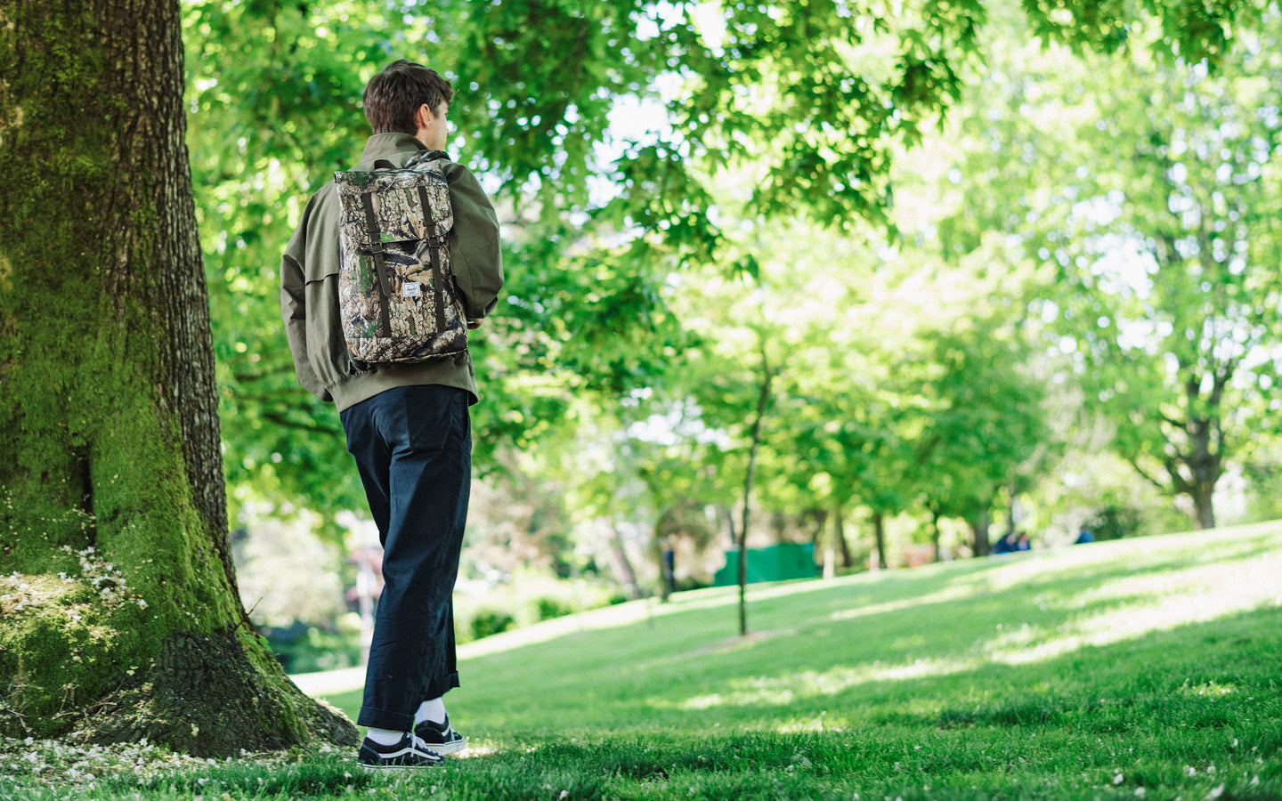 Herschel Retreat Backpack in Realtree APX Camo pattern on a white background.