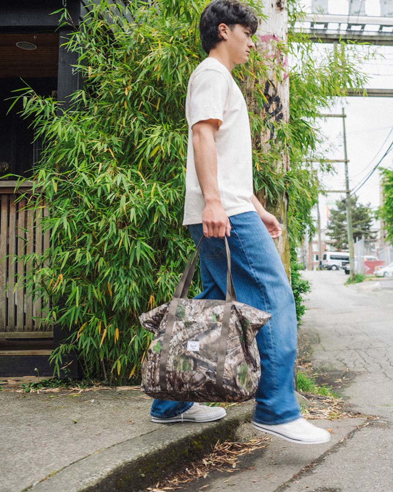 Realtree Portland Packable Tote in Realtree APX camo pattern, shown from the front.