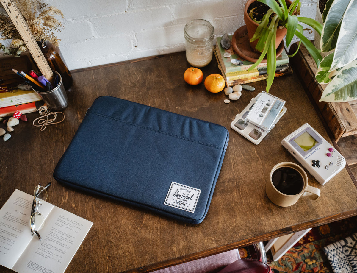 Herschel Supply Co. Anchor 15-16 Inch Sleeve in navy blue, a padded laptop sleeve designed to protect your device.