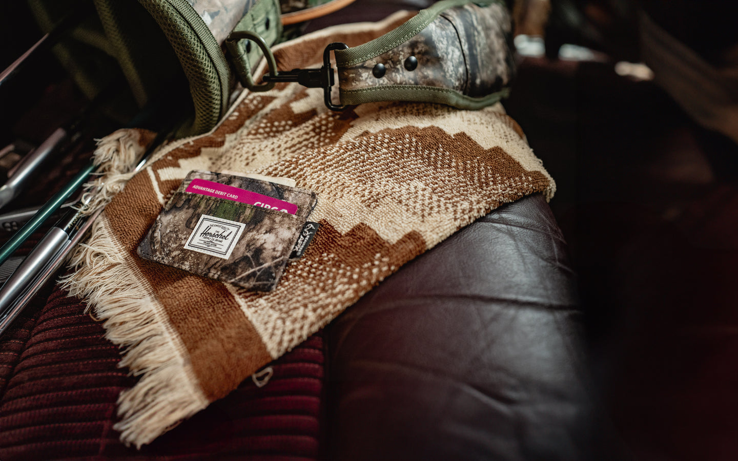 Herschel Supply Co. Realtree Charlie Cardholder in Realtree APX Camo pattern featuring multiple card slots and a top sleeve.