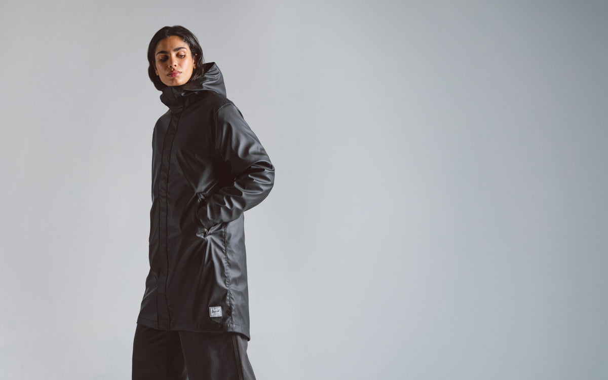 Herschel Supply Co. Women's Long Classic Rain Jacket in solid black.